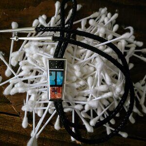 Jimmy Poyer Inlaid Bolo Tie – A Masterpiece of Navajo Artistry
